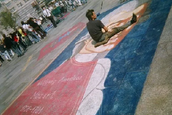Street painter in Köln painting Mozart during a street festival